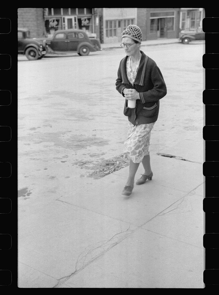 Lady with pint of milk, Moorhead, Iowa. Sourced from the Library of Congress.
