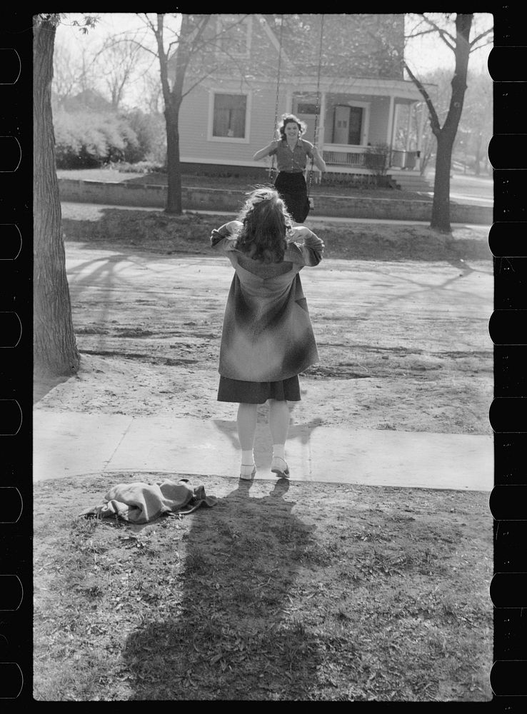 Girl swinging, Woodbine, Iowa. Sourced from the Library of Congress.