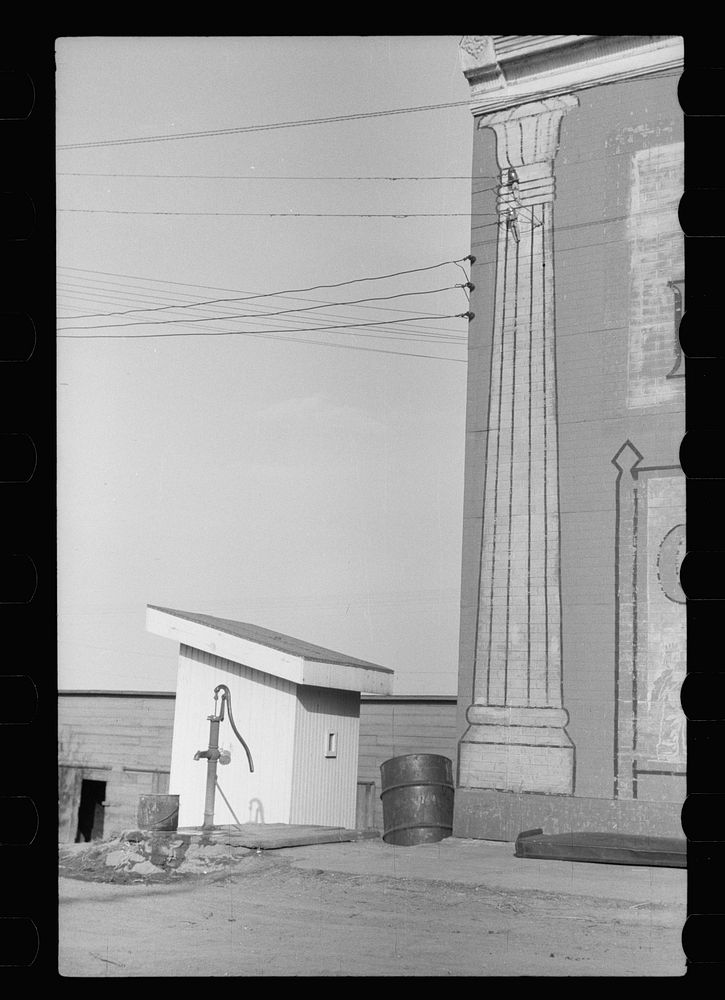Privy pump and pillar, Woodbine, Iowa. Sourced from the Library of Congress.