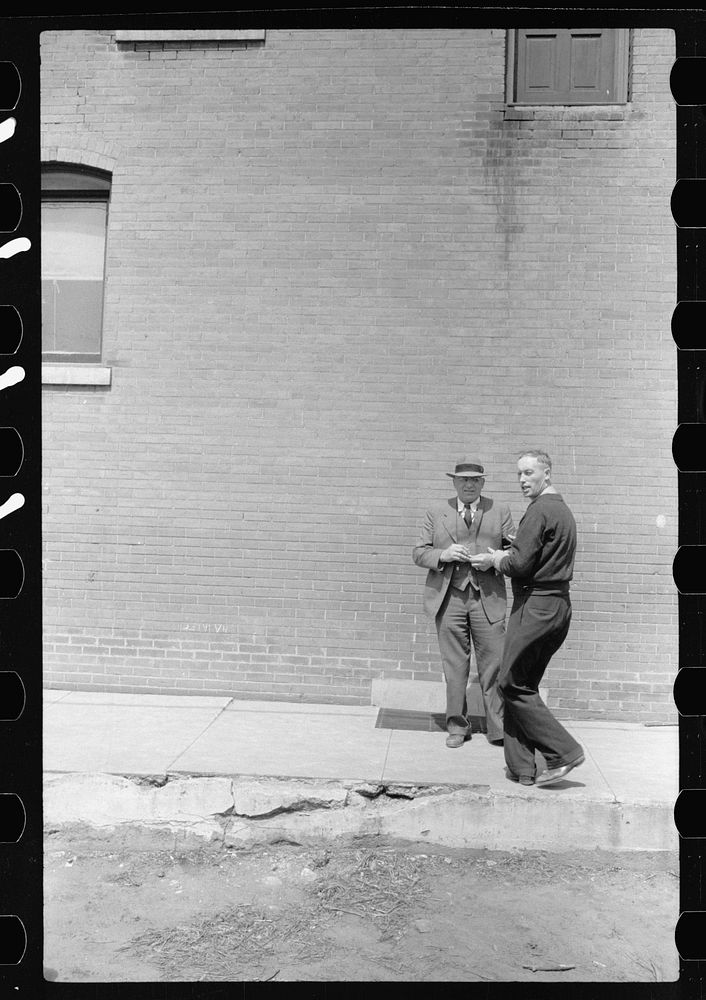 Men talking, Conrad, Iowa. Sourced from the Library of Congress.