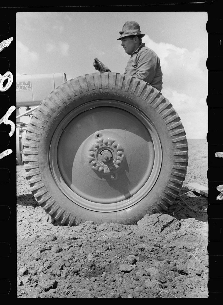 Farm boy operating tractor, Grundy County, Iowa. Sourced from the Library of Congress.