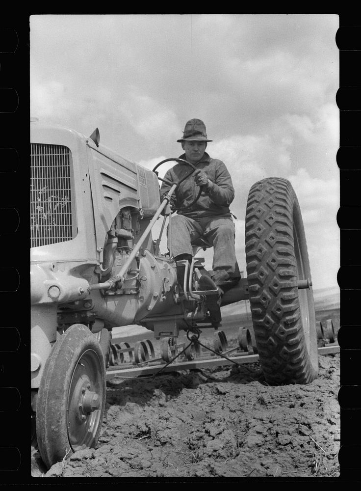 Boy operating tractor, Grundy County, Iowa. Sourced from the Library of Congress.