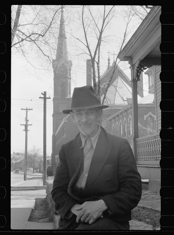Italian resident of Dubuque, Iowa. Catholic church in background. Sourced from the Library of Congress.