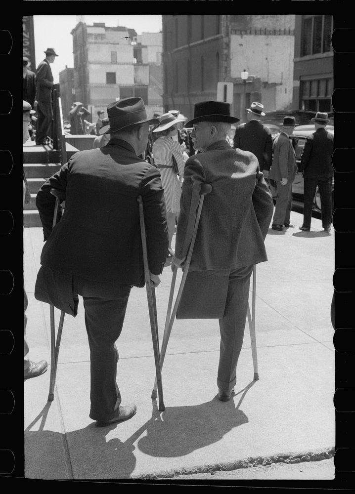 Two one-legged men outside church on Sunday morning, St. Louis, Missouri. Sourced from the Library of Congress.
