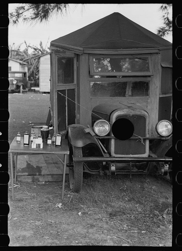 [Untitled photo, possibly related to: One-legged medicine man encamped with the migrant fruit and vegetable workers at Belle…