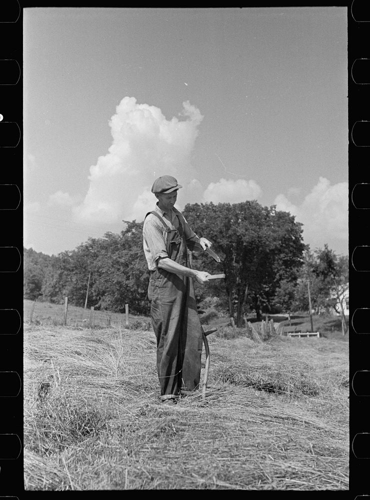 [Untitled photo, possibly related to: Sharpening a scythe, Windsor County, Vermont]. Sourced from the Library of Congress.