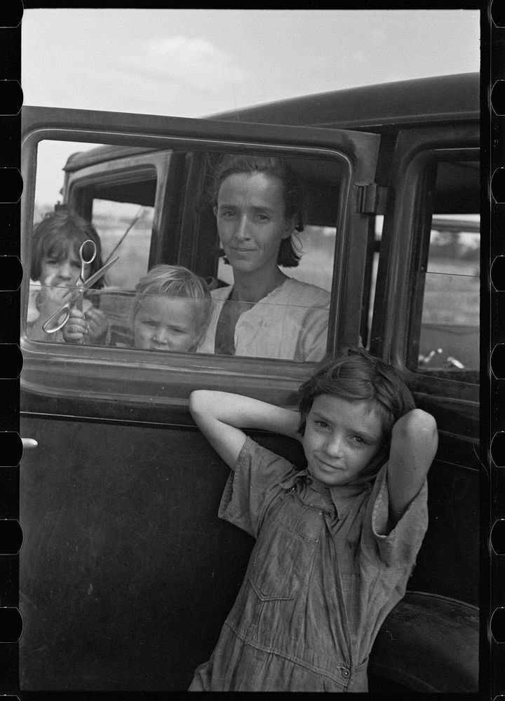 [Untitled photo, possibly related to: The family of a migratory fruit worker from Tennessee now camped in a field near the…