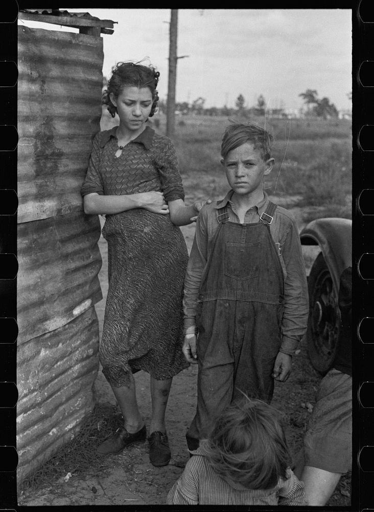 Part of the family of a migrant fruit worker from Tennessee, camped near the packinghouse in Winter Haven, Florida. Sourced…