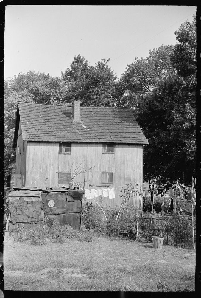 Shack in which families of cranberry pickers are crowded together, Burlington County, New Jersey. Sourced from the Library…