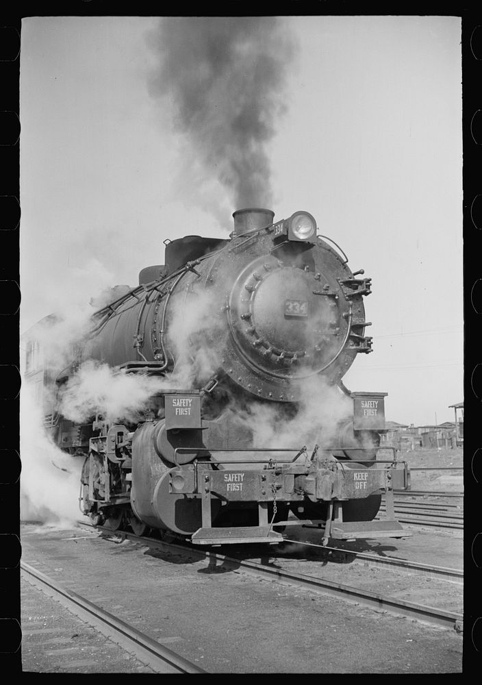 Locomotive in railroad yards along river, St. Louis, Missouri. Sourced from the Library of Congress.