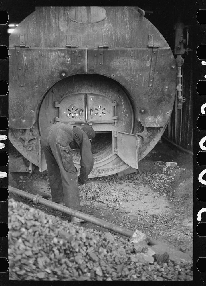[Untitled photo, possibly related to: Stoking furnace at gopher hole, Williamson County, Illinois]. Sourced from the Library…
