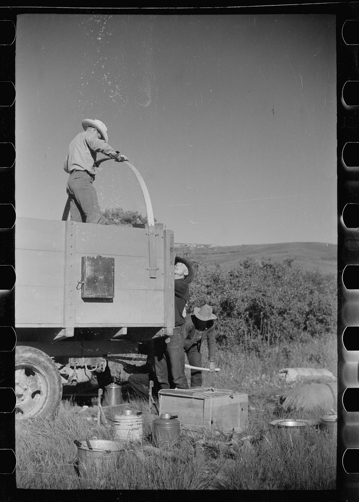 [Untitled photo, possibly related to: Setting up camp, Quarter Circle U roundup, Montana]. Sourced from the Library of…