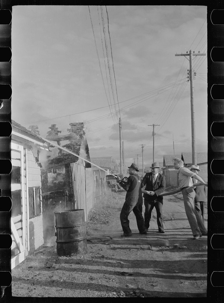 [Untitled photo, possibly related to: Volunteer fire department in action, Terry, Montana]. Sourced from the Library of…