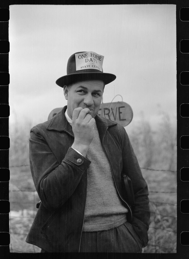 Local newspaper editor, cornhusking contest, Marshall County, Iowa. Sourced from the Library of Congress.