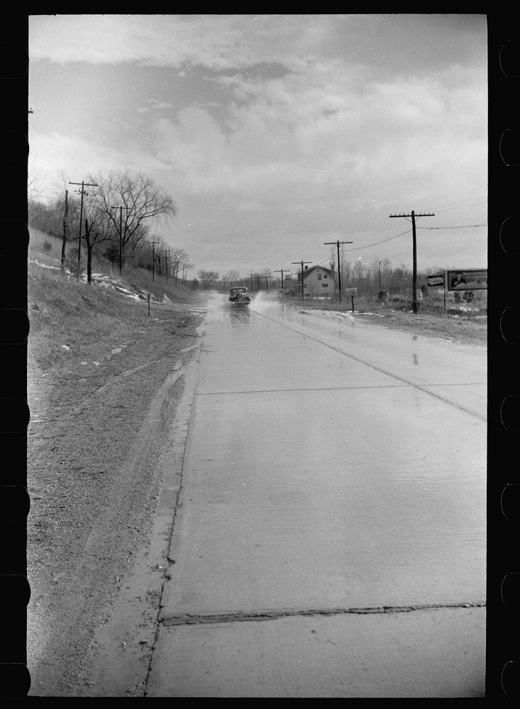 Water on highway due to melting snow, Clermont County, Ohio. Sourced from the Library of Congress.