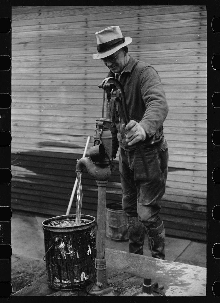 Farmer pumping water, Parke County, Indiana. Sourced from the Library of Congress.