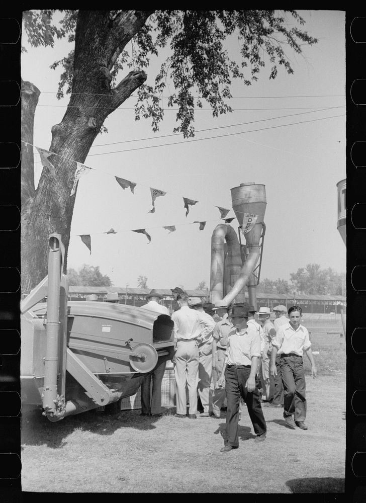 [Untitled photo, possibly related to: Farmer inspects a cultivator, Central Iowa 4-H Club fair, Marshalltown, Iowa]. Sourced…