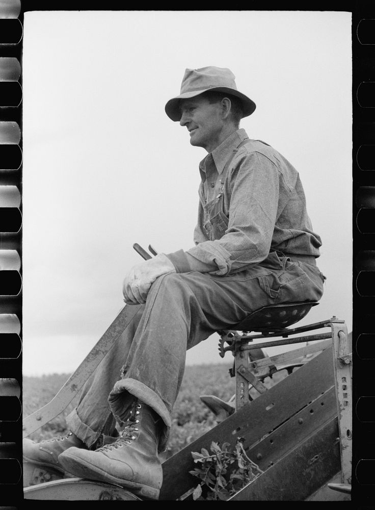 [Untitled photo, possibly related to: Farmer on one-row potato digger, Rio Grande County, Colorado]. Sourced from the…