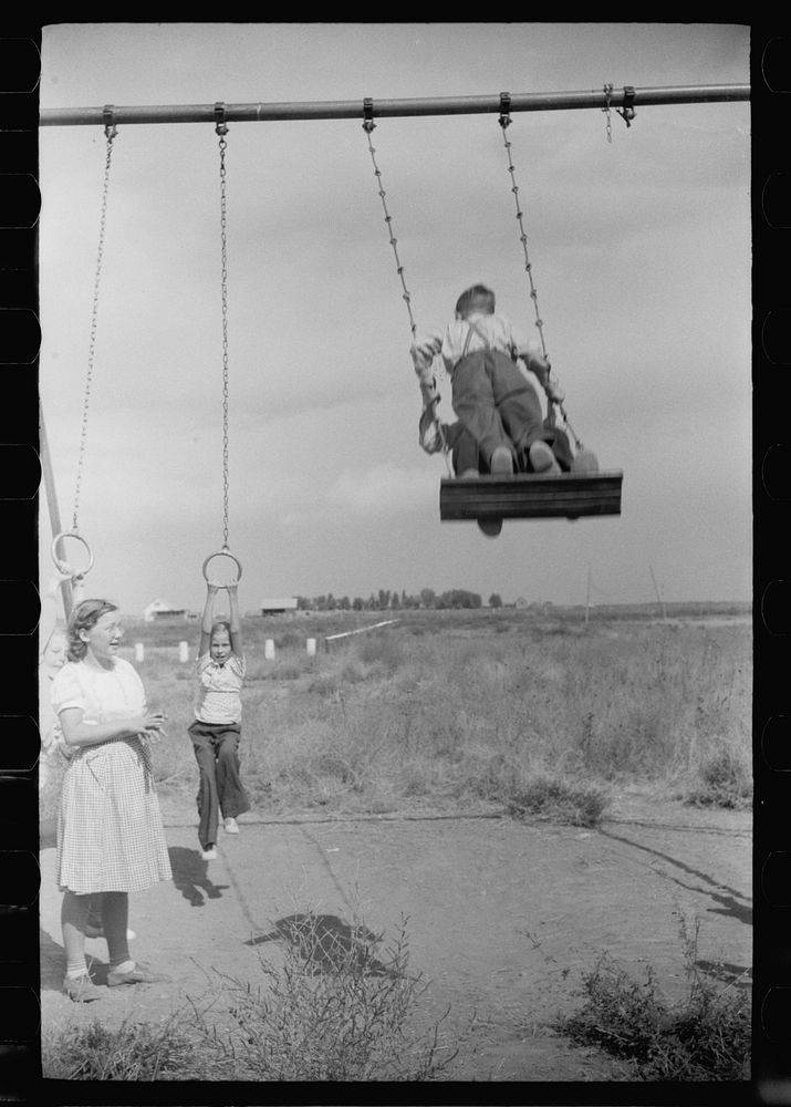 [Untitled photo, possibly related to: Children of resettlement families playing in the schoolyard, community building, San…