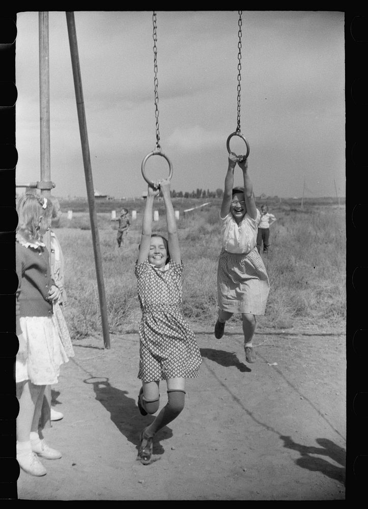 [Untitled photo, possibly related to: Children of resettlement families playing in the schoolyard, community building, San…