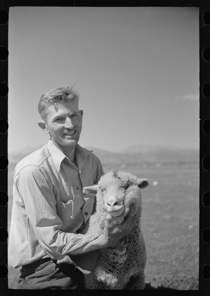 Elmo Temple, Chaffee County, Colorado rehabilitation client poses with one of his lambs. Sourced from the Library of…