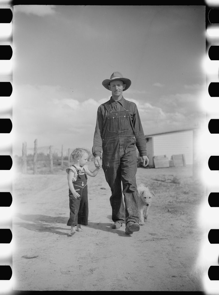 Thomas W. Beede, resettlement client, Western Slope Farms, Colorado poses with his youngest daughter. Sourced from the…