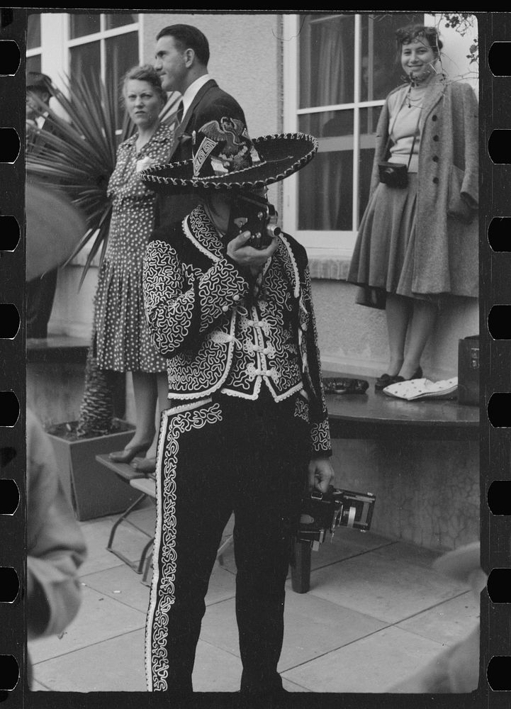 [Untitled photo, possibly related to: Tourists watch costume show, Charro Days, Brownsville, Texas]. Sourced from the…