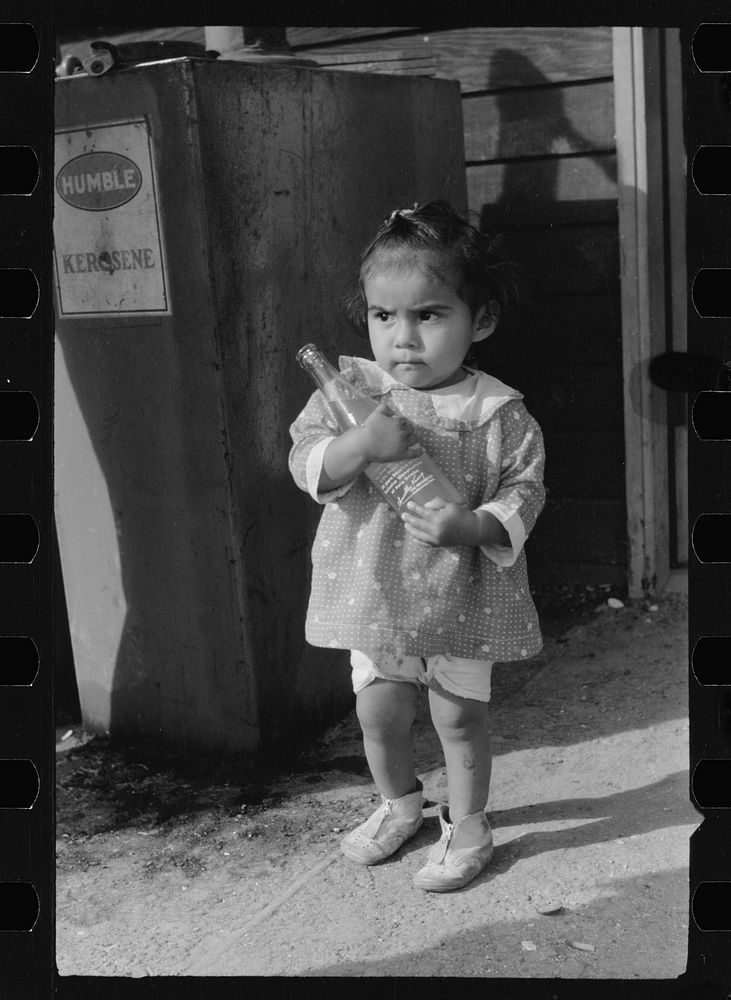 Migratory worker's child at community store, FSA (Farm Security Administration) camp, Sinton, Texas. Sourced from the…