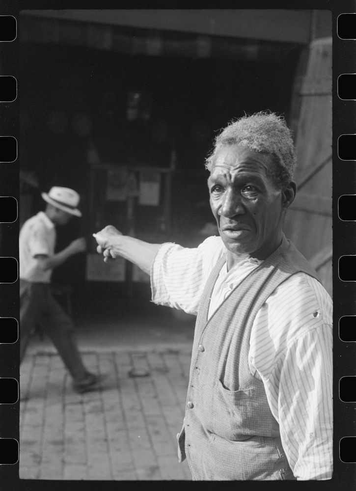[Untitled photo, possibly related to: Travelling evangelist, alley dwelling section, Washington, D.C.]. Sourced from the…