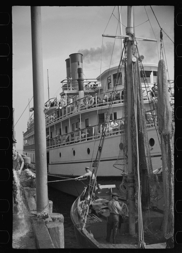[Untitled photo, possibly related to: The economy of a town: fishing and the tourist trade. A fishing boat in front of the…