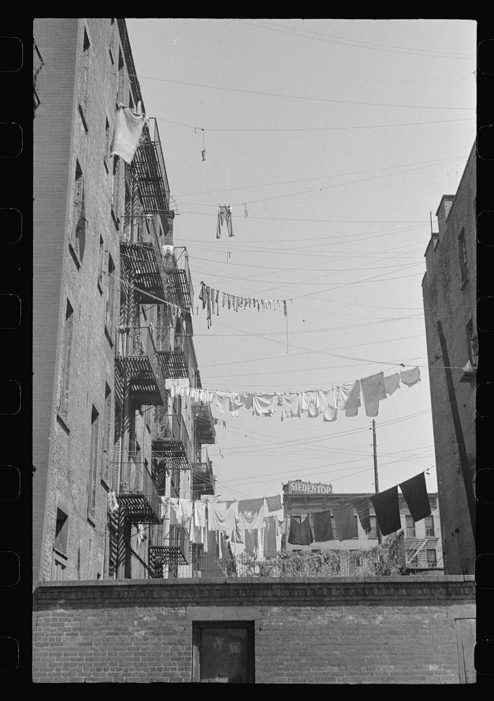 New York, New York. 61st Street between 1st and 3rd Avenues. Apartment houses from the rear. Sourced from the Library of…