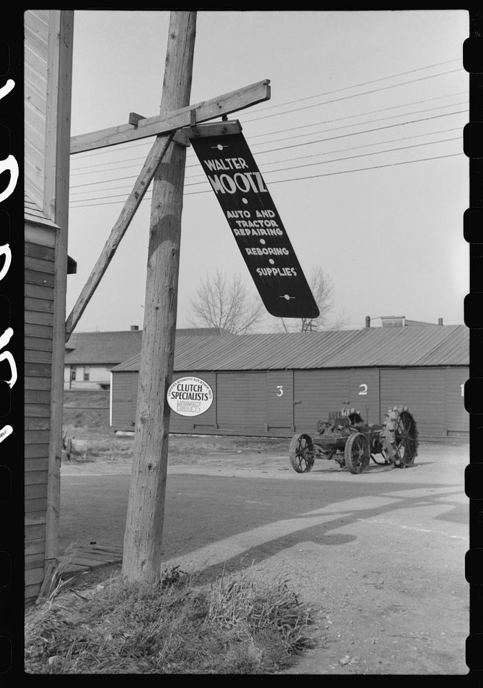 Metal sign blowing in the wind. Doyon, North Dakota. Sourced from the Library of Congress.