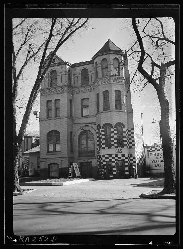 Gasoline station converted from private dwelling. Example of "blight." Washington, D.C.. Sourced from the Library of…