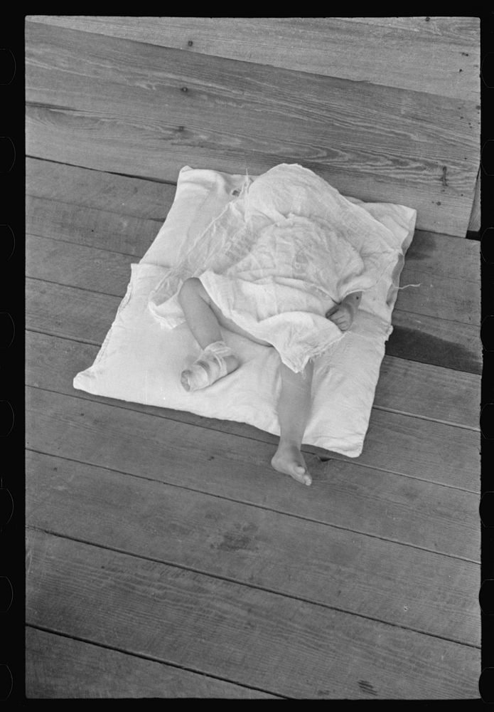 [Untitled photo, possibly related to: Squeakie asleep (Othel Lee Burroughs). Son of a Hale County, Alabama cotton…