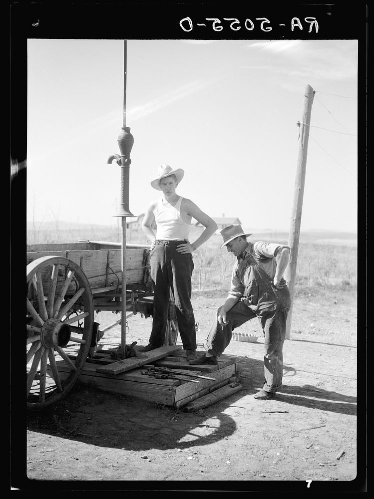 Fixing a dried well on the farm of Mrs. Emma Knoll. Grant County, North Dakota. Sourced from the Library of Congress.