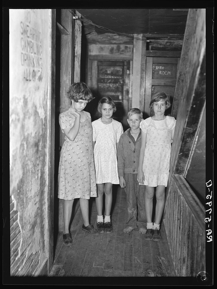Children of citrus workers in hallway of apartment house. Winterhaven, Florida. Sourced from the Library of Congress.