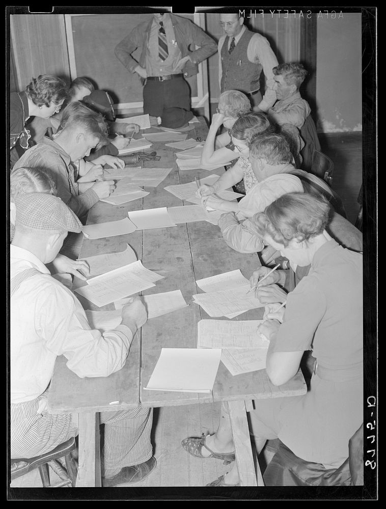 Rehabilitation clients working out farm and home plans at group meeting. York, Nebraska. Sourced from the Library of…