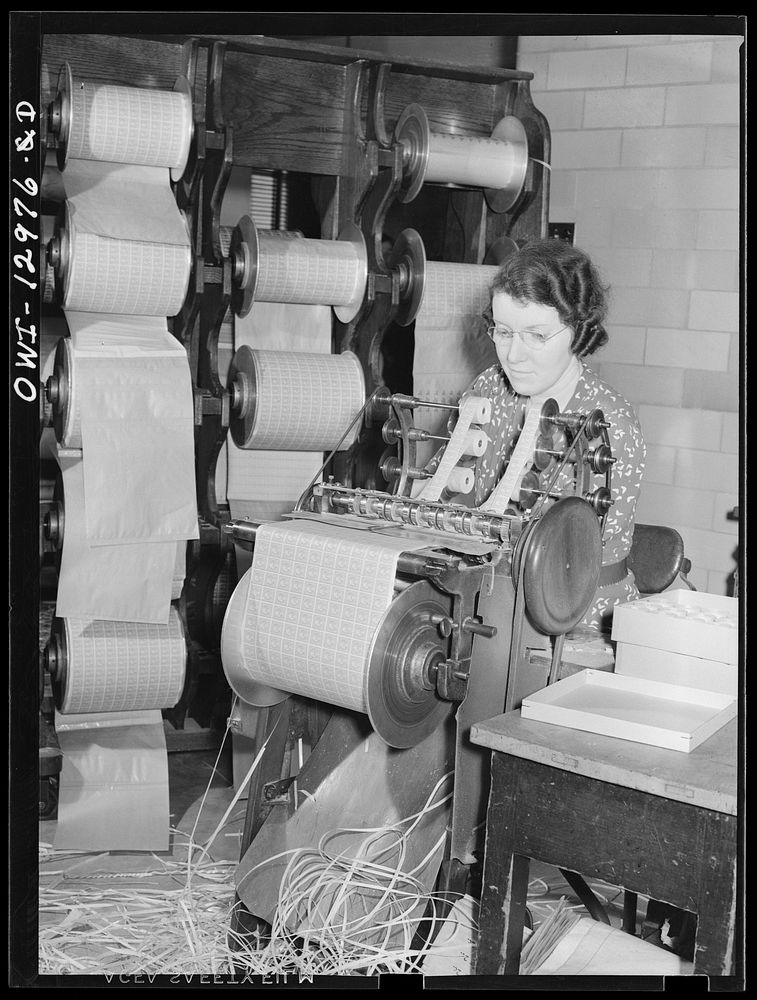 Washington, D.C. Stamp coiling machine at the United States Bureau of Engraving and Printing. Sourced from the Library of…