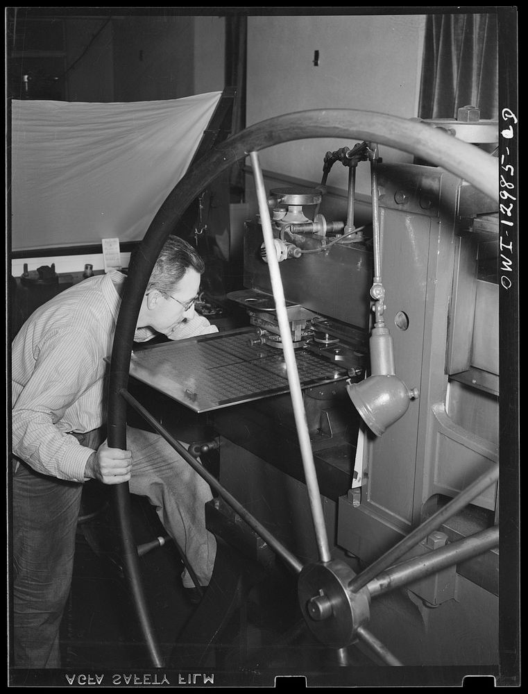 Washington, D.C. Sideographer transferring image from postage stamp die to steel plate at the United States Bureau of…