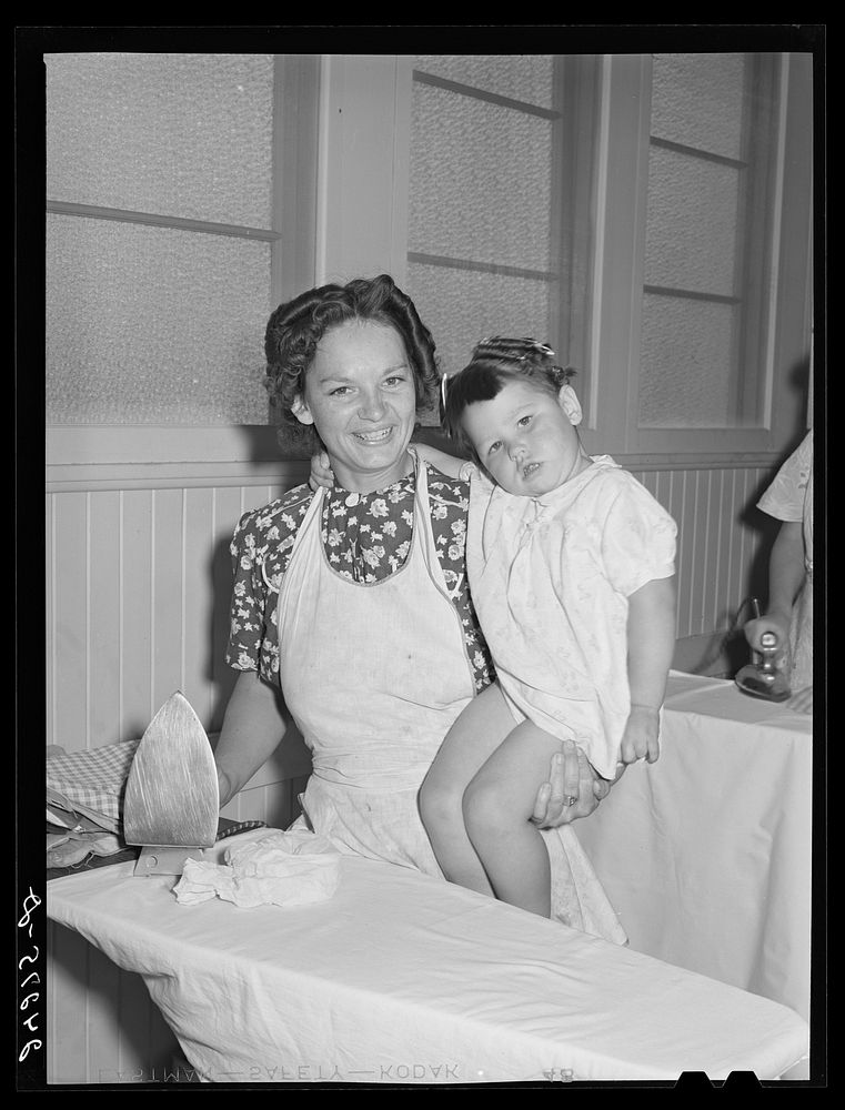 Mother and child in laundry. Tulare migrant camp. Visalia, California. Sourced from the Library of Congress.