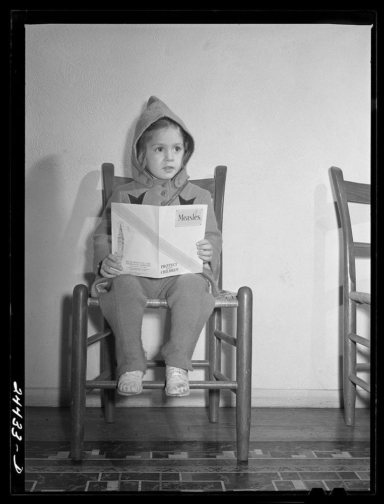 Elizabeth Darkey, daughter of one of the project families, waiting in the health center to be inoculated against measles.…