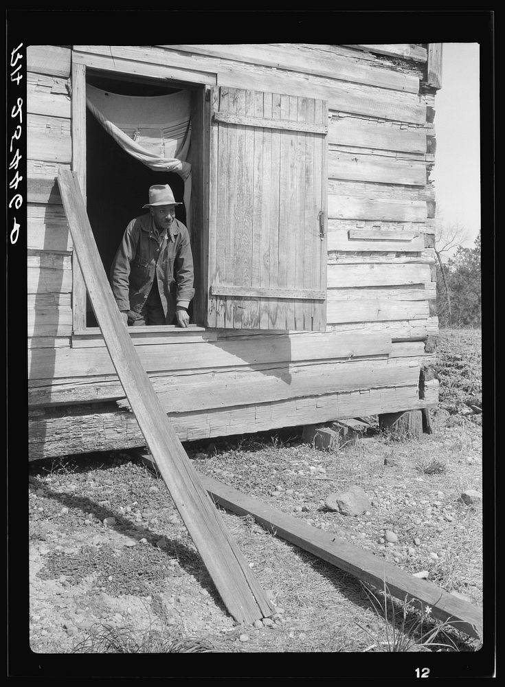 Tenant farmer in his cabin. Macon County, Alabama. Sourced from the Library of Congress.