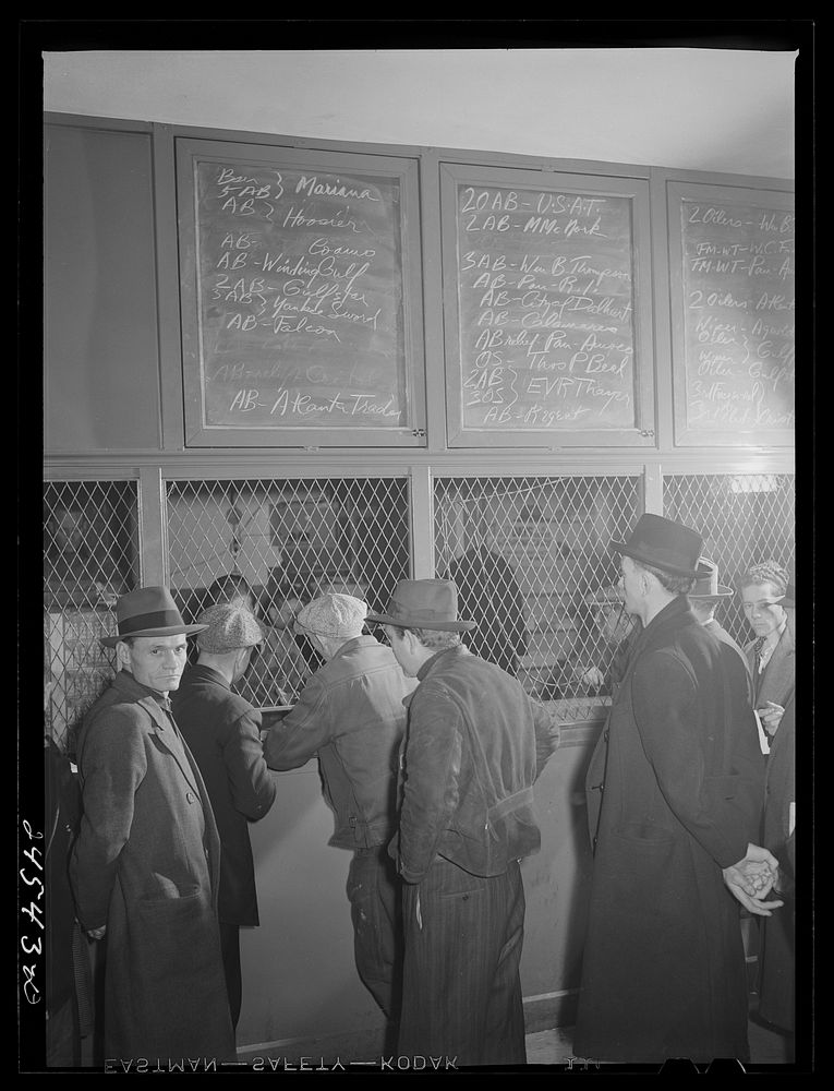 Listing ships in need of sailors. Hiring hall, National Maritime Union. New York City. Sourced from the Library of Congress.
