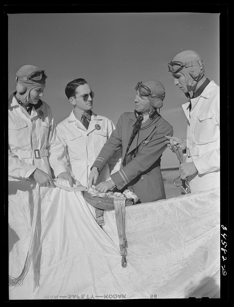 [Untitled photo, possibly related to: Instructor explaining operation of parachute to student pilots. Meacham Field, Fort…