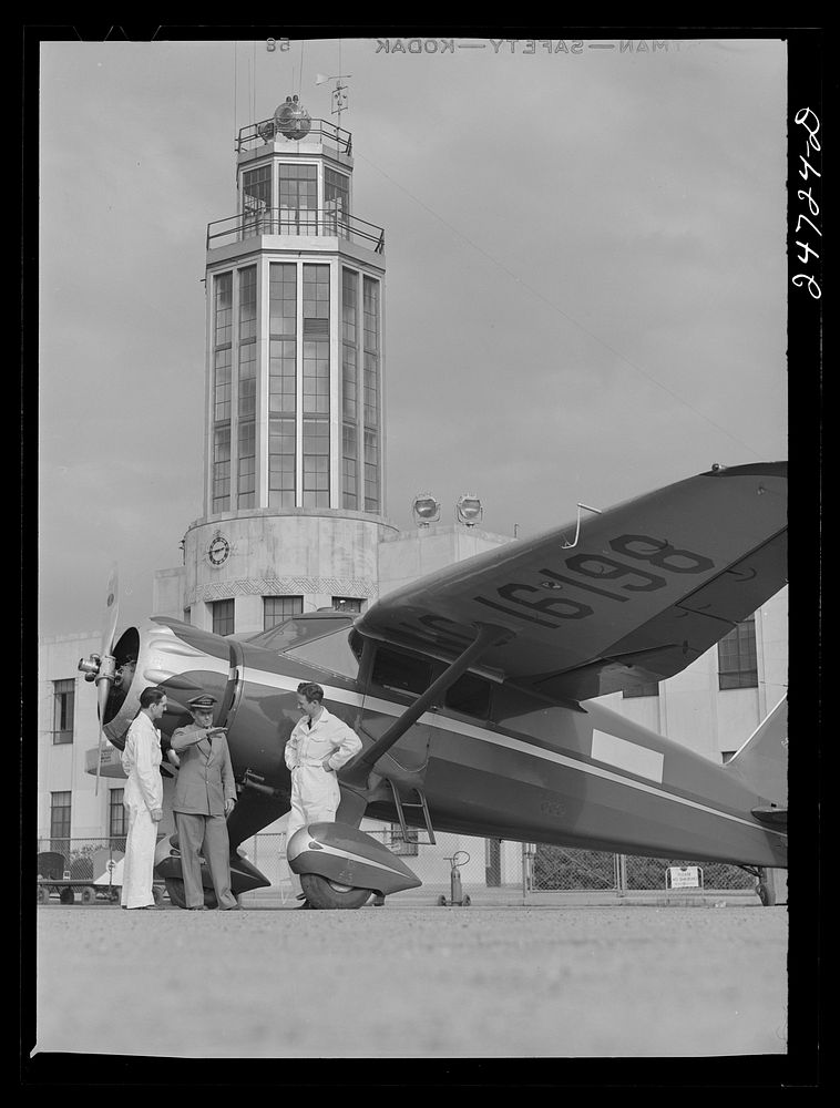 Fort Worth, Texas. Meacham Field. Students and instructor. Control tower in background. Sourced from the Library of Congress.