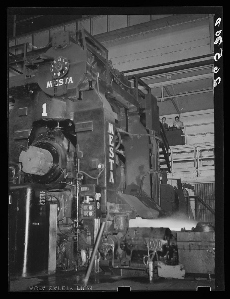 Operating one of the big rollers in production of sheet steel. Pittsburgh, Pennsylvania. Sourced from the Library of…
