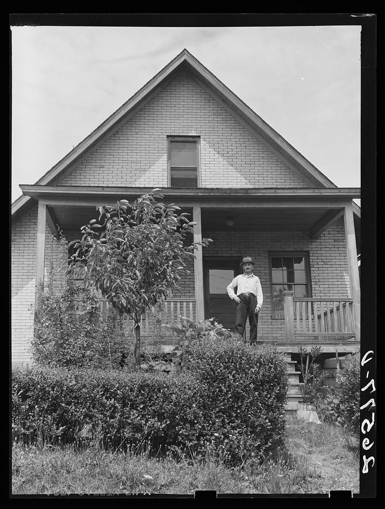 John Koltias on the steps of his home. Aliquippa, Pennsylvania. Sourced from the Library of Congress.