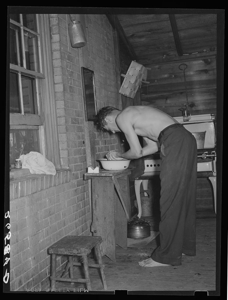 One of John Koltias' sons. Also, a steel worker washing before breakfast. Aliquippa, Pennsylvania. Sourced from the Library…