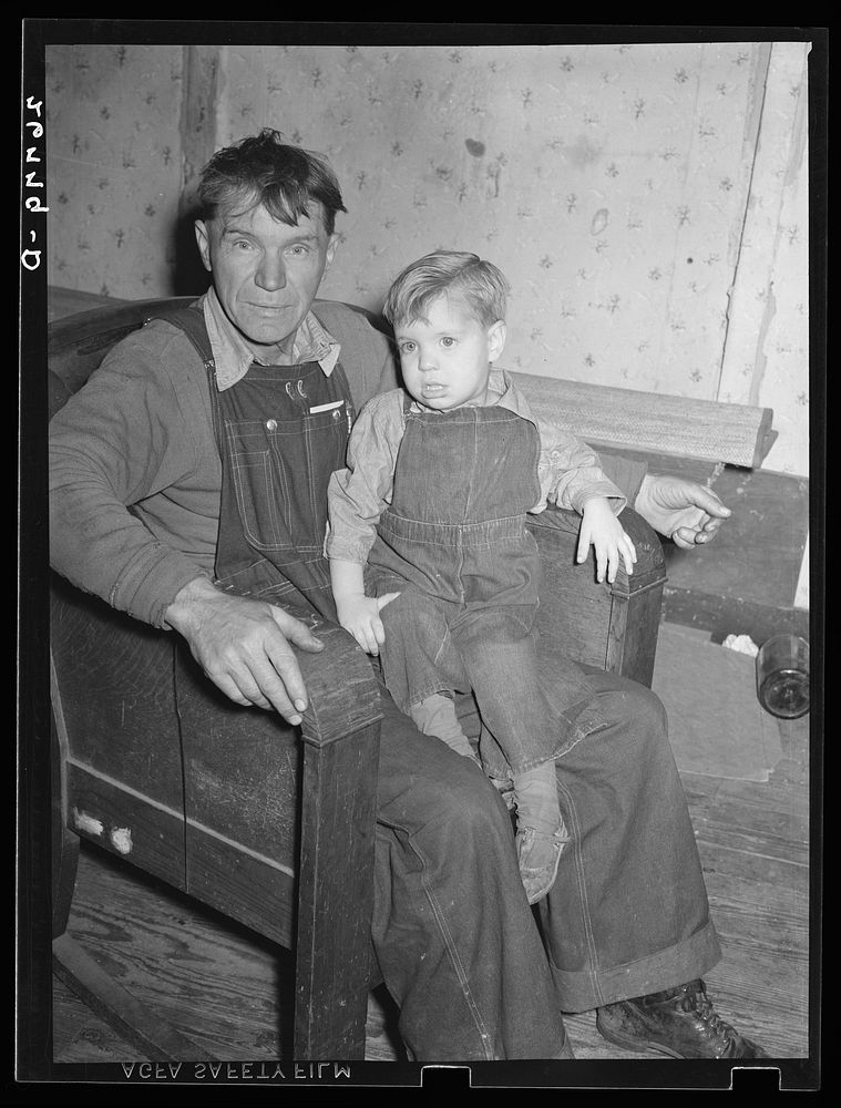 Coal miner now on relief, with son. Zeigler, Illinois. Sourced from the Library of Congress.
