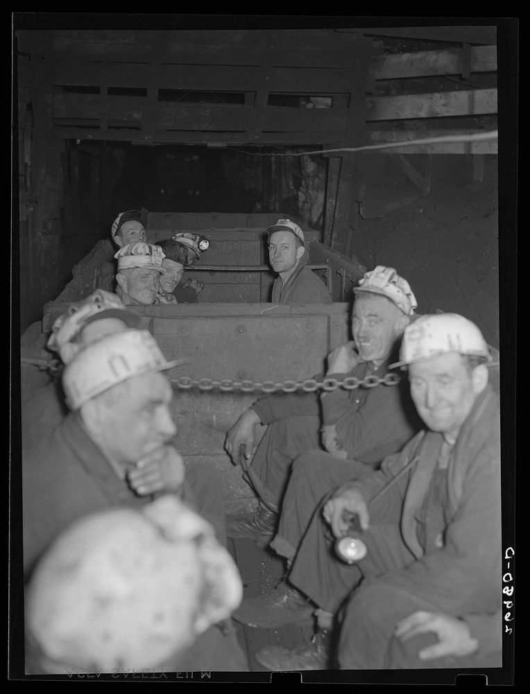 Underground at Old Ben number eight mine. These men are on a "man-trip" which goes three and half miles to the face of the…